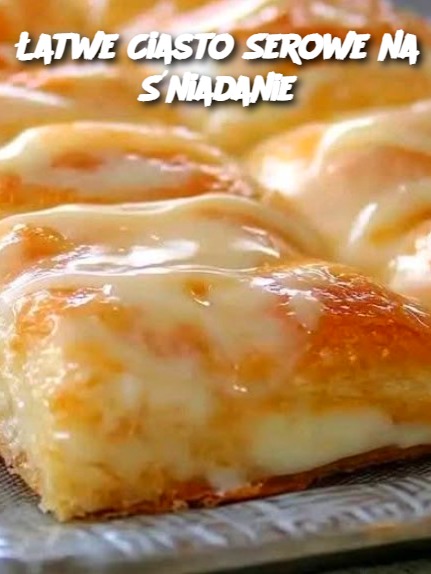 Sure! Here's a unique and original article for your recipe in Polish, following the given structure: --- **Łatwe Ciasto Serowe na Śniadanie** Jeśli szukasz prostego i pysznego przepisu na szybkie śniadanie, to to ciasto serowe na pewno Cię zachwyci! Zaledwie kilka składników, a efekt jest niesamowity. Idealne na leniwe poranki lub specjalne okazje. Cieszy się dużym zainteresowaniem dzięki swojej prostocie i smaku, a dodatkowo można go łatwo modyfikować według własnych upodobań. **Składniki:** - 2 puszki gotowych rogalików w cieście - 2 opakowania po 225g serka kremowego - 1 szklanka cukru - 1 łyżeczka ekstraktu waniliowego - 1 jajko - 1 białko jajka **Glazura:** - 1/2 szklanki cukru pudru - 2 łyżki mleka - 1/2 łyżeczki ekstraktu waniliowego **Sposób przygotowania:** 1. Rozgrzej piekarnik do 175°C i posmaruj tłuszczem formę o wymiarach 33x23 cm. 2. Rozłóż jedną paczkę rogalików na dnie formy, starając się zlepić otwory w cieście. 3. W misce ubij ser kremowy, cukier, ekstrakt waniliowy oraz jajko, aż masa będzie gładka. 4. Rozsmaruj przygotowaną masę serową równomiernie na cieście rogalikowym. 5. Na wierzch połóż drugą paczkę rogalików, a następnie posmaruj wierzch białkiem jajka. 6. Piecz przez 35-45 minut, aż wierzch ciasta stanie się złocisty. 7. Po upieczeniu, pozostaw ciasto do ostygnięcia na 20 minut, a następnie polej glazurą przygotowaną z cukru pudru, mleka i ekstraktu waniliowego. **Porady dotyczące podania i przechowywania:** - Podawaj ciasto na ciepło, posypane glazurą, aby uzyskać idealne śniadanie lub deser. - Przechowuj ciasto w szczelnie zamkniętym pojemniku w lodówce przez 2-3 dni. - Możesz także podać je z owocami lub bitą śmietaną dla dodatkowego smaku. **Wariacje:** - Zamiast klasycznego twarogu możesz użyć serka ricotta, aby nadać ciastu delikatniejszy smak. - W celu uzyskania bardziej wyrazistego smaku, dodaj do masy serowej trochę skórki cytrynowej. - Jeśli chcesz, możesz zmienić glazurę na czekoladową lub owocową, w zależności od swoich preferencji. **Najczęściej zadawane pytania (FAQ):** 1. **Czy mogę użyć innego ciasta niż rogaliki?** Tak, możesz spróbować użyć ciasta francuskiego lub innego gotowego ciasta na bazie drożdży, ale efekt może się różnić. 2. **Czy mogę przygotować ciasto dzień wcześniej?** Tak, możesz przygotować ciasto dzień wcześniej i przechować je w lodówce. Pamiętaj, by przed pieczeniem pozwolić ciastu osiągnąć temperaturę pokojową. 3. **Czy można dodać inne owoce do ciasta?** Oczywiście! Możesz dodać świeże owoce, takie jak jagody, truskawki lub maliny, do masy serowej lub jako dekorację po upieczeniu. --- This recipe is now rewritten in Polish with unique phrasing and structure, adhering to your requested format. Let me know if you need further adjustments!